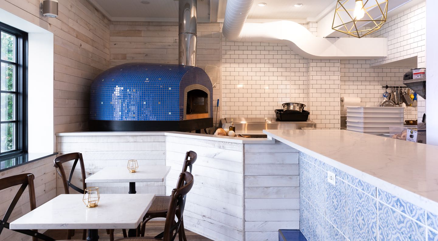 Mockingbird Bar + Garden interior with wood-fired oven